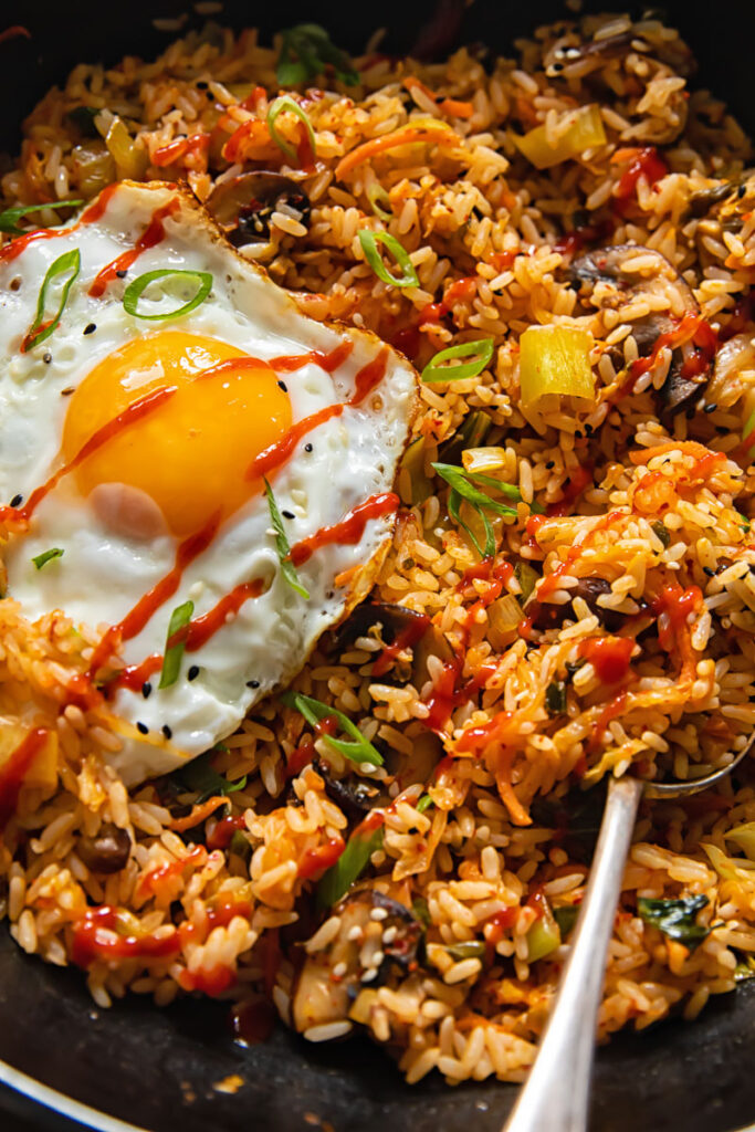 Close up view of fried rice with an fried egg on top