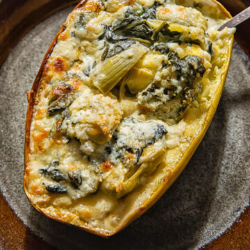 Spaghetti sauce on stuffed with spinach and artichoke on a plate