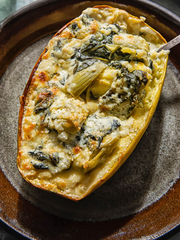 Spaghetti sauce on stuffed with spinach and artichoke on a plate