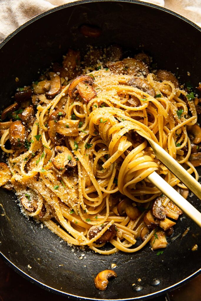 Top down of mushroom carbonara in a pan