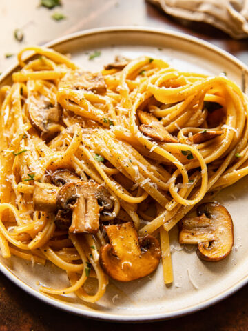 Side shot of vegetarian mushroom carbonara on a plate