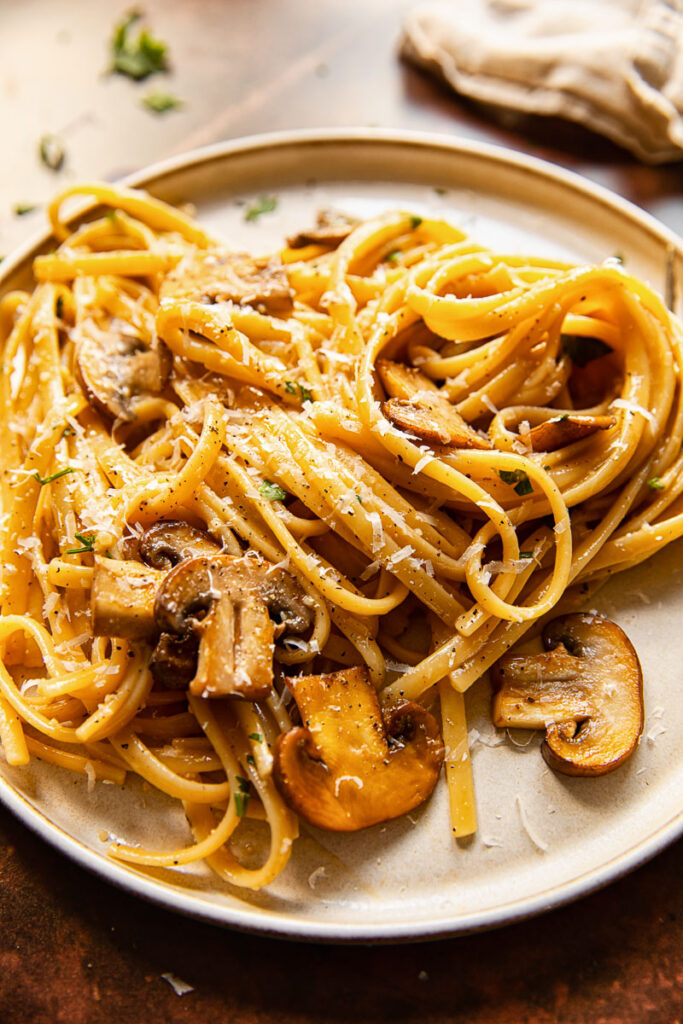 Side shot of vegetarian mushroom carbonara on a plate