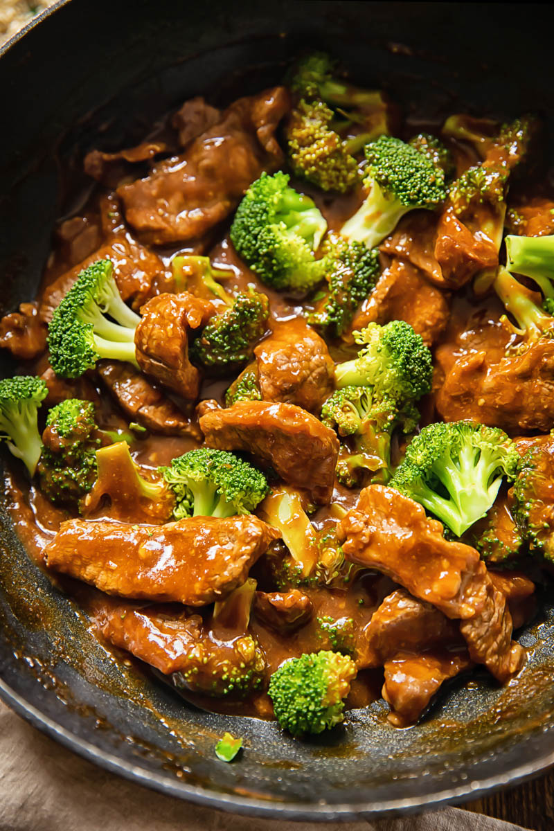Flavor-Packed Beef and Broccoli 5 Wok filled with freshly cooked Beef and Broccoli Stir Fry, steaming hot.