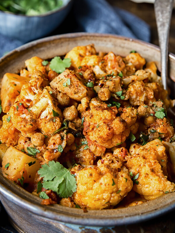 close up of aloo gobi in a clay pot