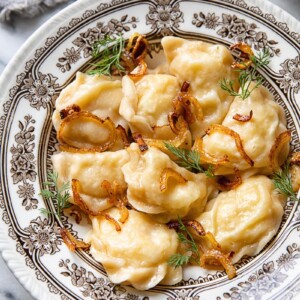 bowl of potato vareniki with onions and dill