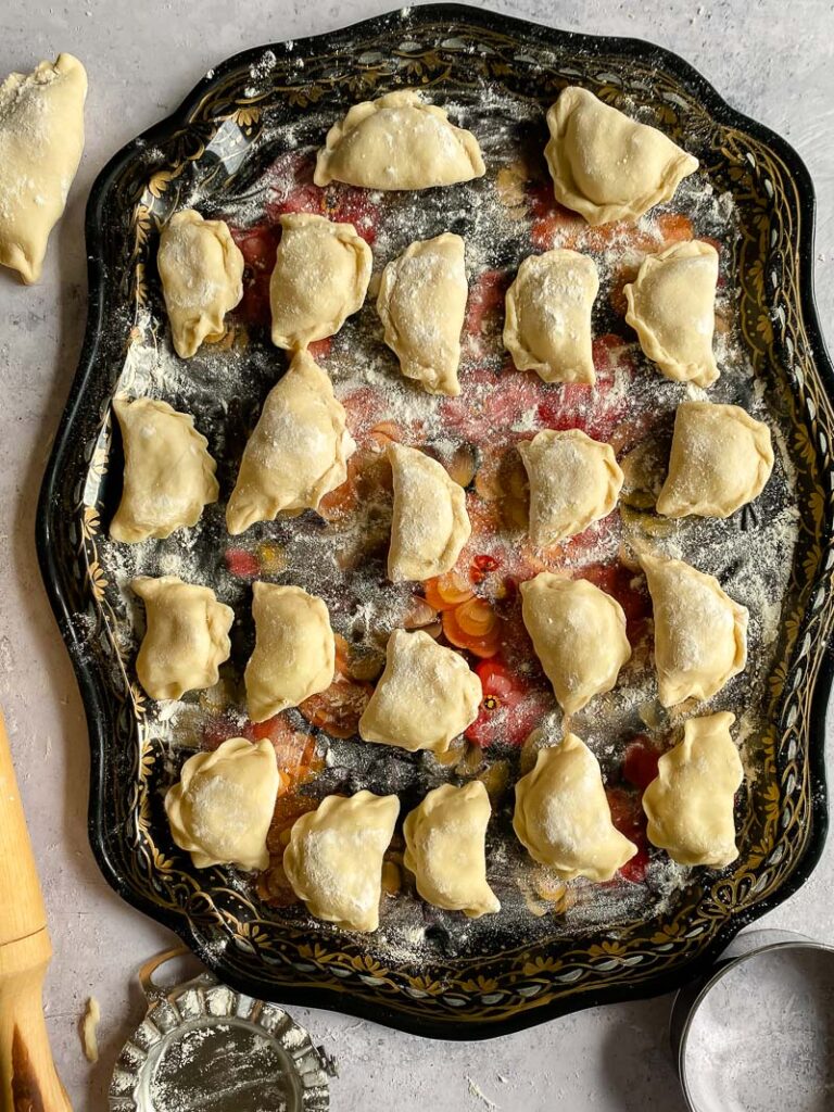 platter of uncooked potato Pierogi