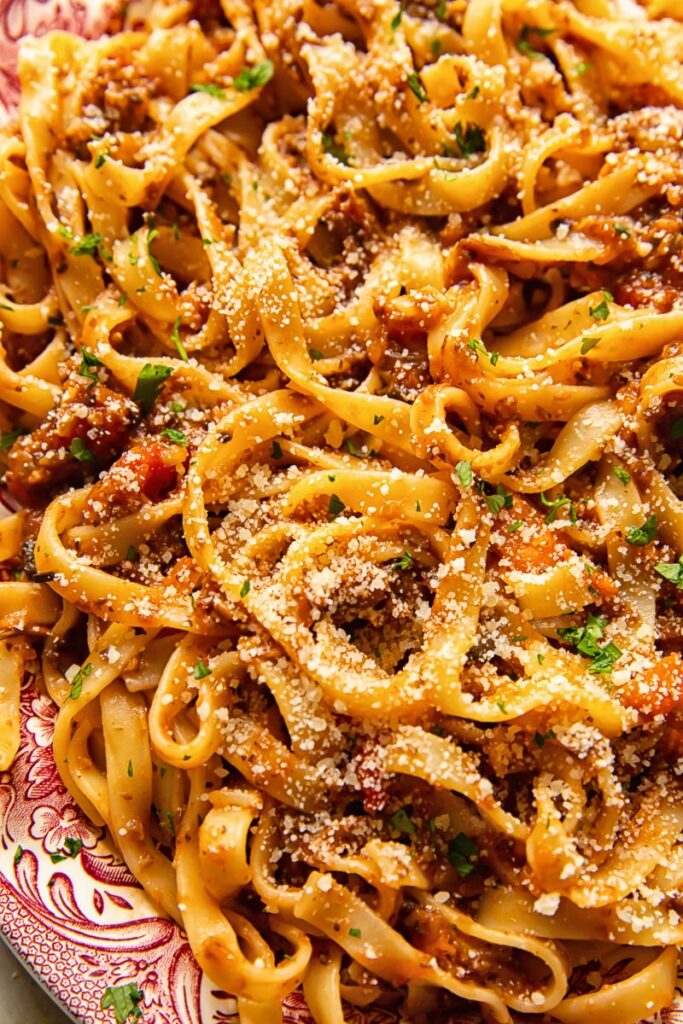 Close up of pasta mixed with bolognese