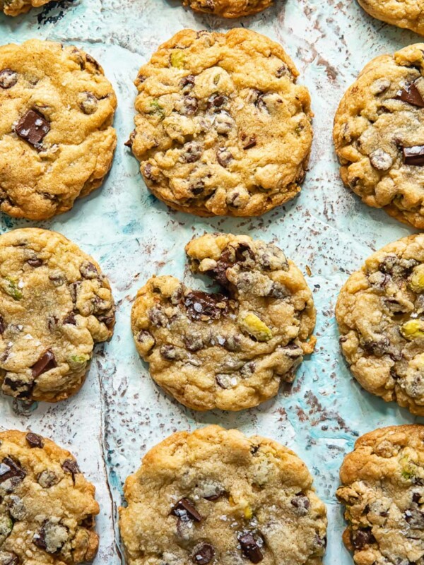 Top down shot of chocolate chip cookies laid out on a baking sheet