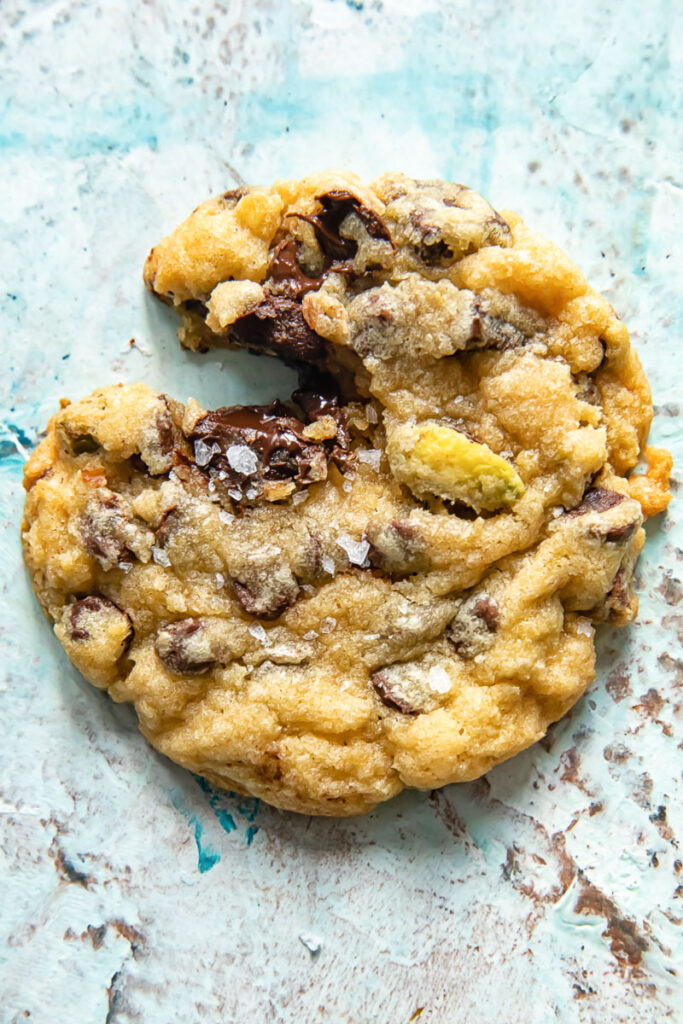 Close up shot of a chocolate chip cookie with a bite taken out