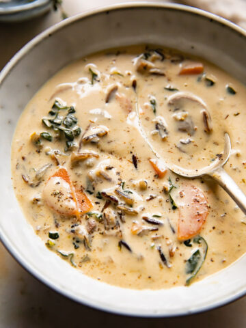 Bowl with creamy soup and spoon