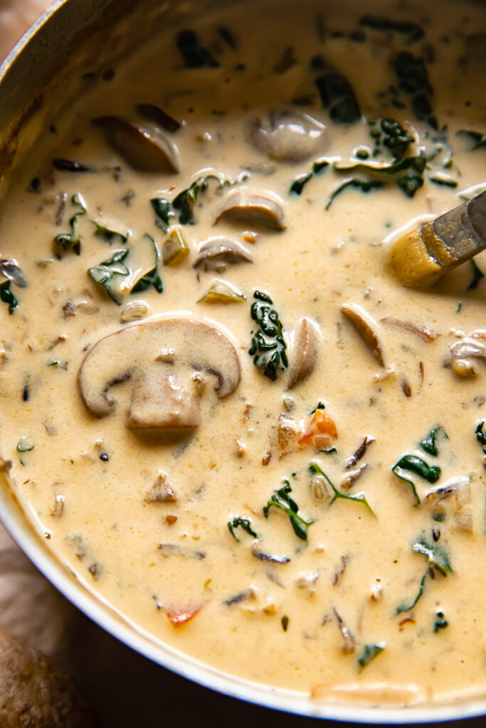 Close up showing mushroom, kale and cream