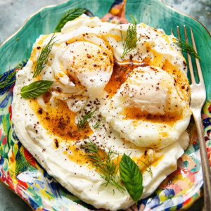 Colourful plate of Turkish eggs with a fork