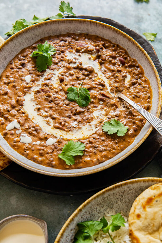 Dal makhani in a bowl with a spoon