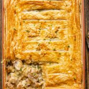 Top down shot of chicken and leak pie in a ractangular baking dish