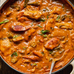 Chicken and sausage gumbo in a large pot with okra peppers and celery