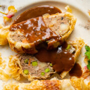 slices of ground beef wellington with gravy