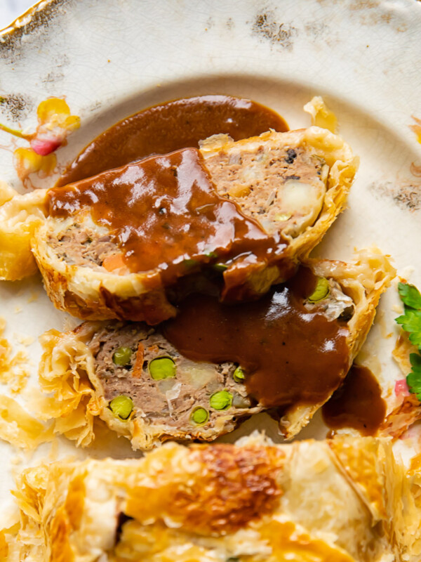 slices of ground beef wellington with gravy