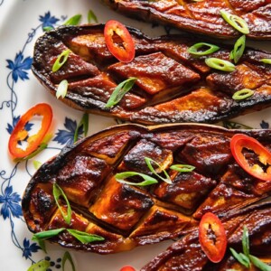 four glazed eggplant on a plate from close up