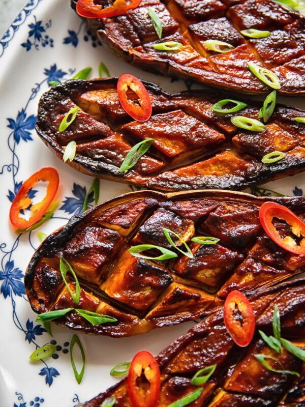 four glazed eggplant on a plate from close up