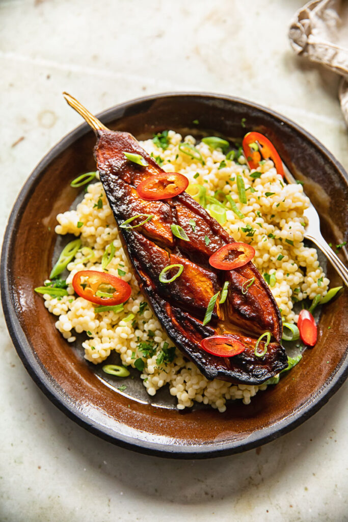 Miso-glazed aubergine on a bed of couscous