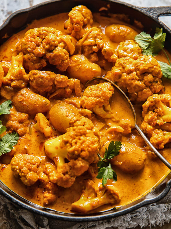 cast iron pan with potato cauliflower tikka masala