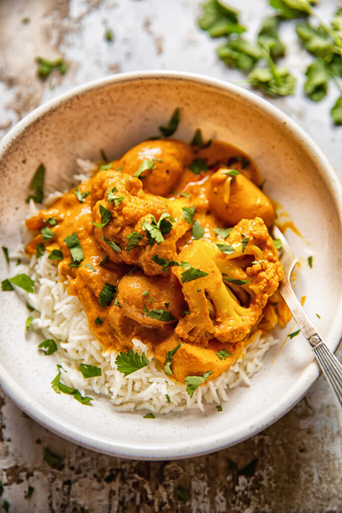 bowl with rice and tikka masala curry