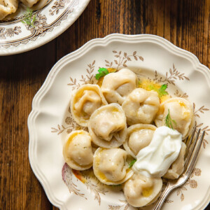 topdown view of dumpling on a plate and another bowl in the corner