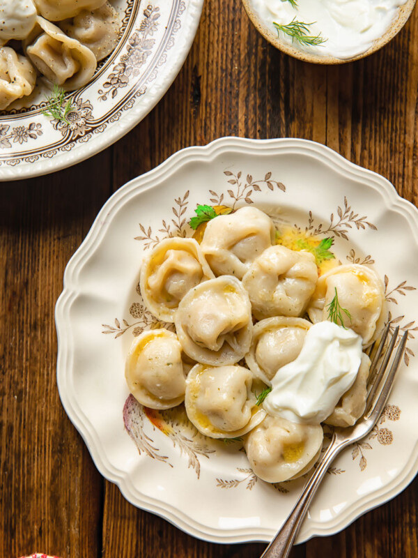 topdown view of dumpling on a plate and another bowl in the corner