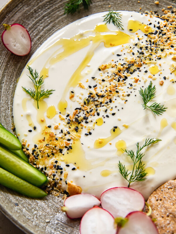 Close up of whipped feta dip with vegetables on a plate