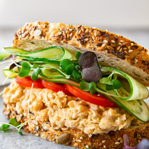 Angled view of chickpea salad sandwich on a plate