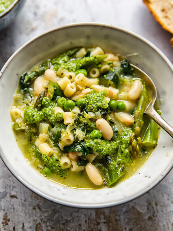 bowl of vegetarian minestrone soup with a spoon