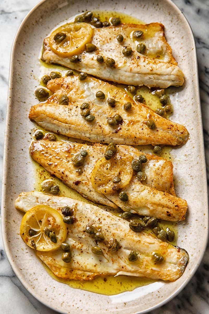 serving plate with four sea bass fillets