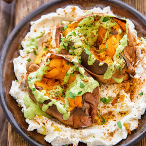 plate of two roasted sweet potatoes with sauces
