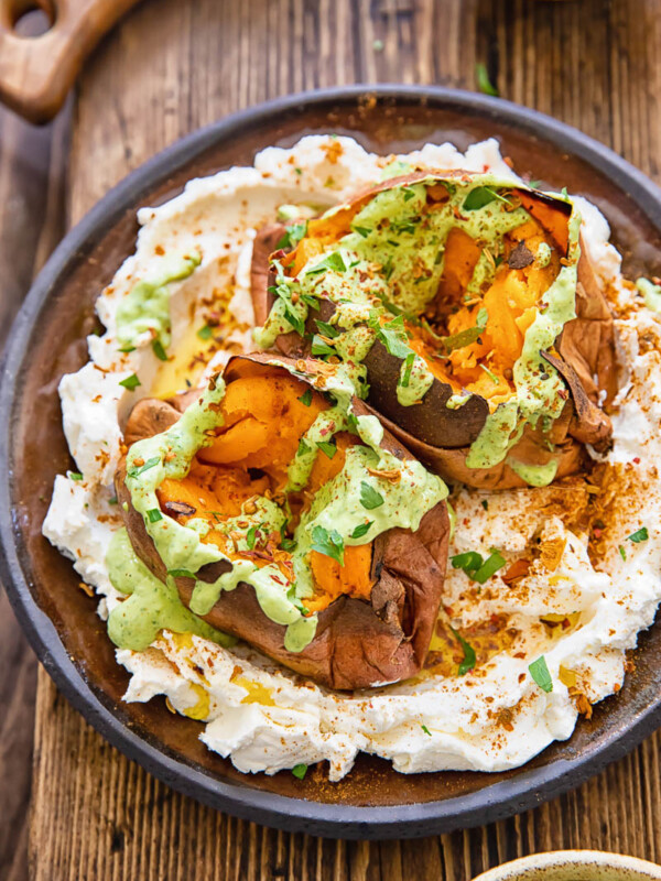 plate of two roasted sweet potatoes with sauces