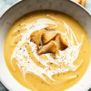 Bowl of curried roasted parsnip soup with croutons
