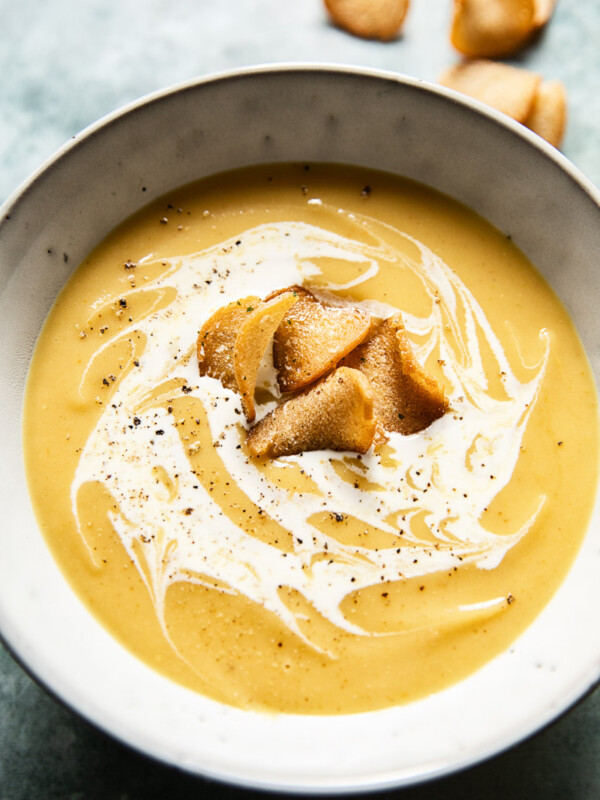 Bowl of curried roasted parsnip soup with croutons