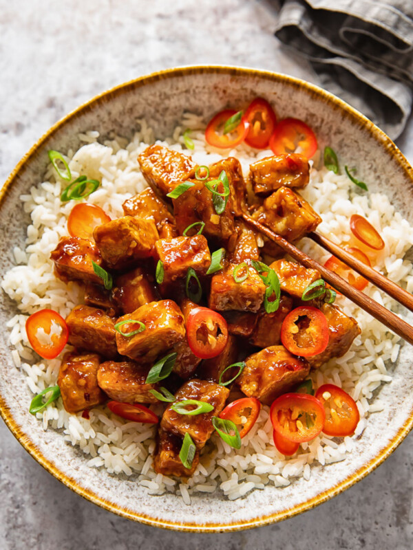 bowl of hoisin glazed tofu and chopsticks