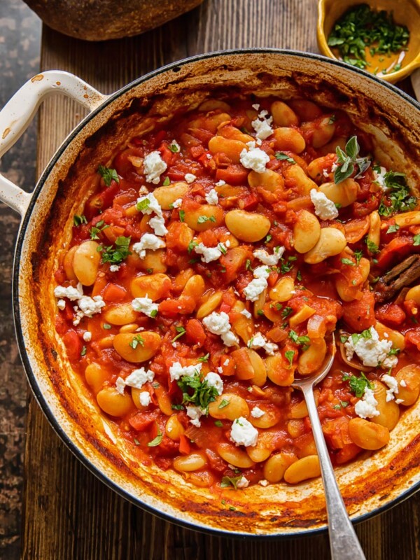 Pan of butter bean stew in a pot with spoon
