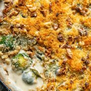 Close up shot of cheesy Brussels sprouts gratin in a deep pan topped with breadcrumbs
