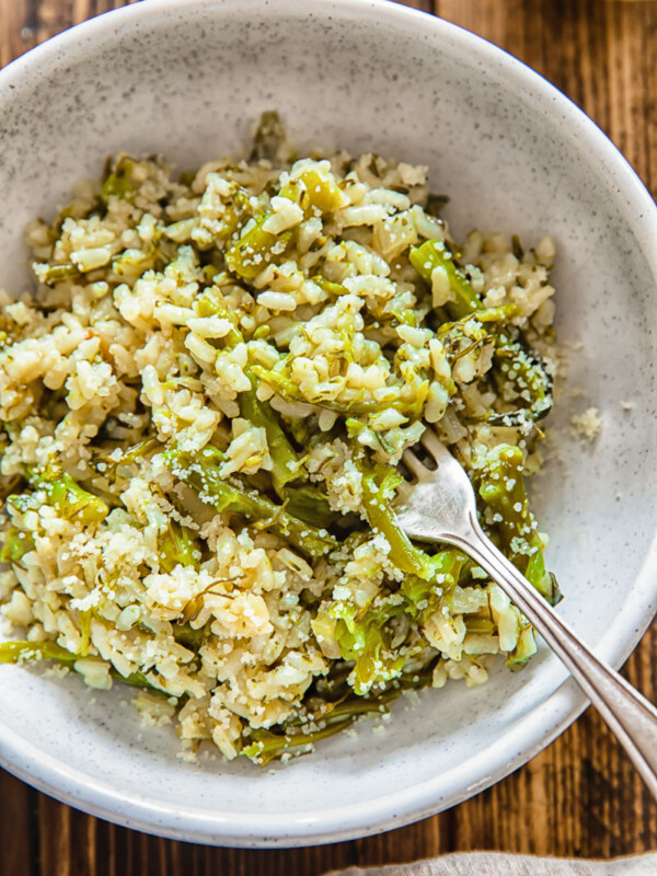 Close up of a small bowl with risotto and a fork