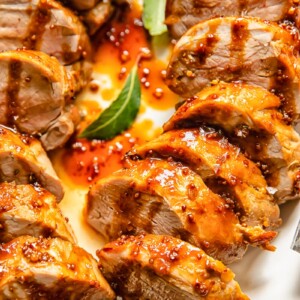 Top down shot of molasses pork loin slices on a plate