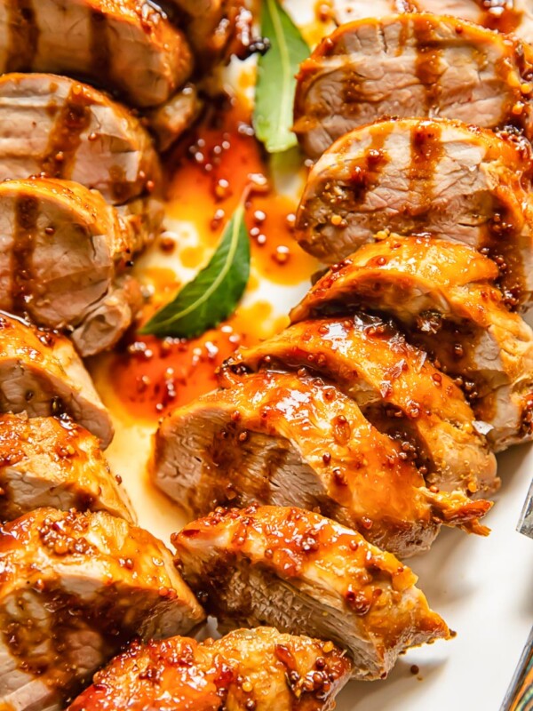 Top down shot of molasses pork loin slices on a plate