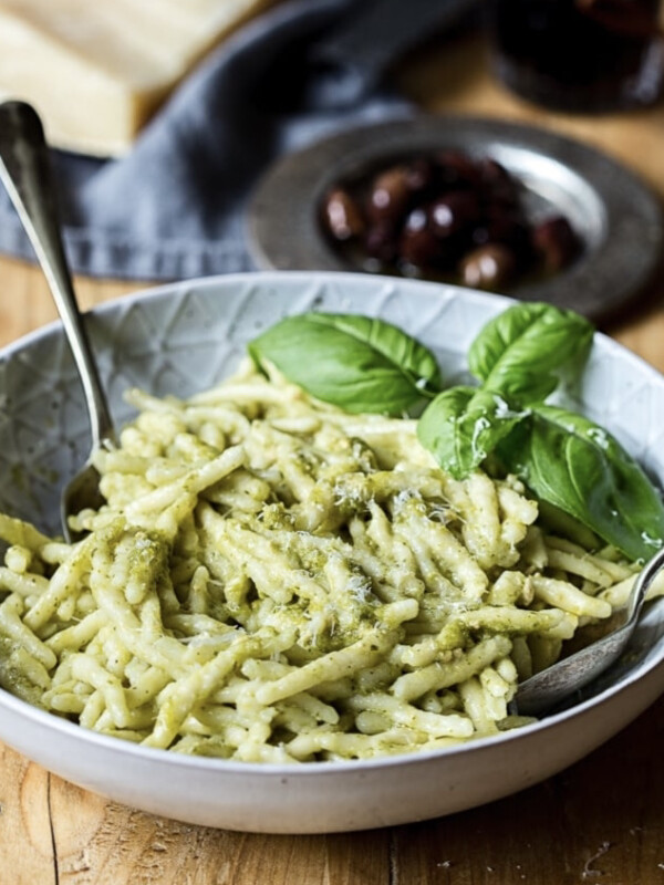 Close up view of pasta with additional basil leaf