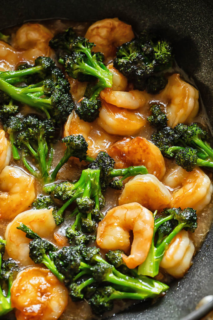 Close up shot of shrimp and broccoli stir fry in a pan