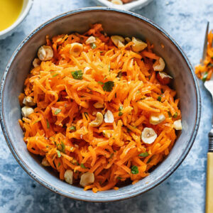 Top down shot of french carrot salad in a small bowl