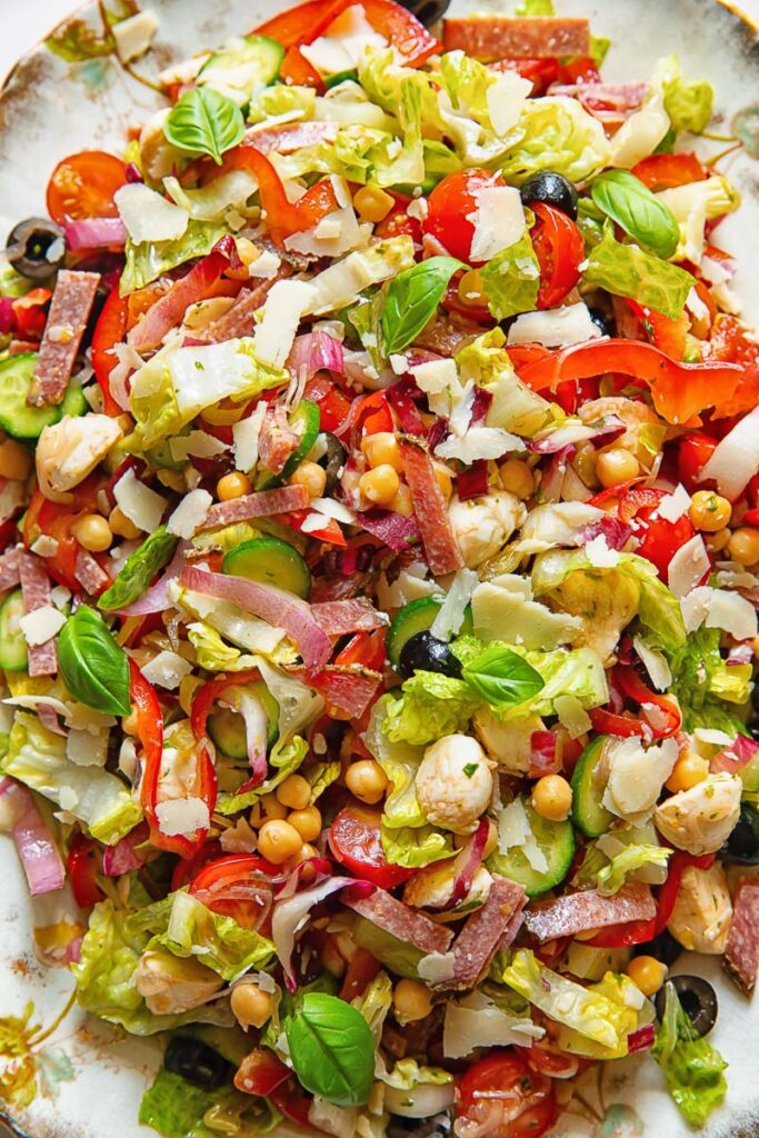 Top down shot of Italian chopped salad topped with Parmesan
