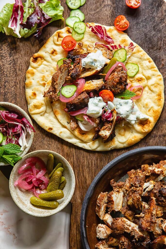 Top down shot of chicken shawarma on a flatbread
