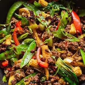 Top down shot of beef stir fry in a large pan