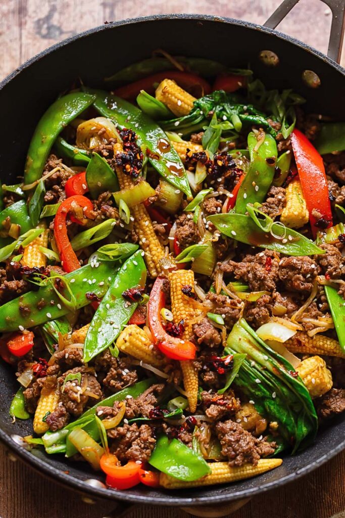 Top down shot of beef stir fry in a large pan