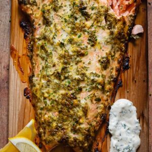 Top down shot of cedar plank salmon on a cutting board